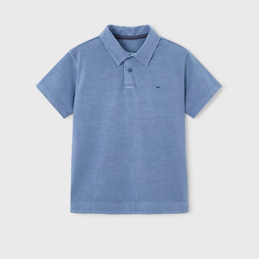 Blue polo shirt on a light gray background