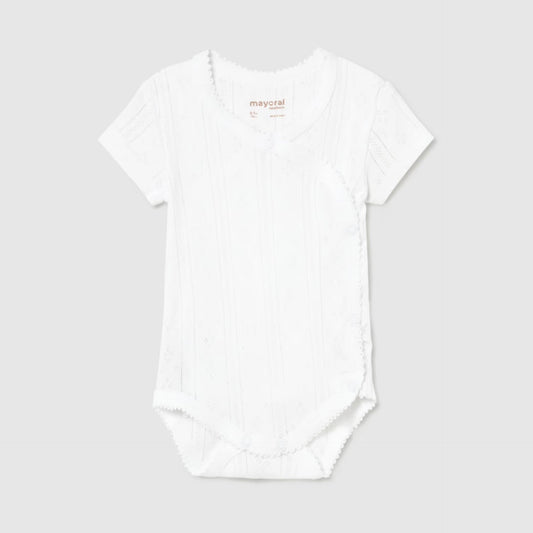 White pointelle bodysuit on a light gray background
