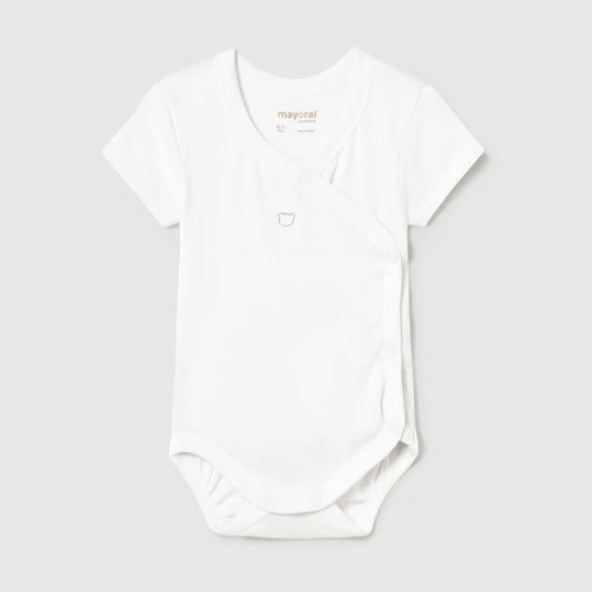 White baby onesie on a light gray background