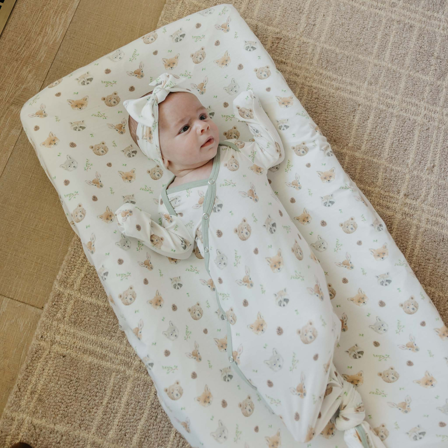 White baby knotted gown with woodland animal prints