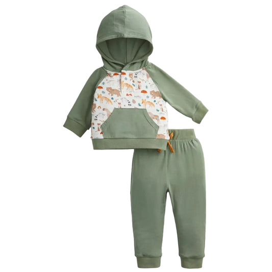 A two-piece baby clothing set consisting of a sage green hooded sweatshirt with a white chest panel featuring a colorful forest animal print, paired with matching sage green jogger pants, shown on a light gray background.