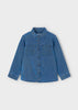 Blue denim shirt on a light gray background