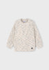 Textured sweater on a light gray background