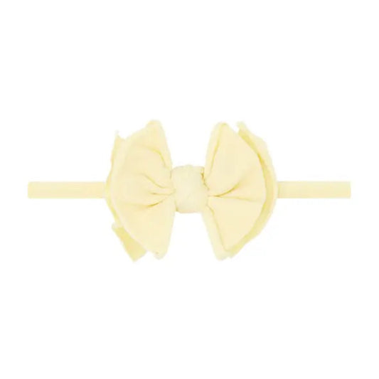 Yellow bow on a headband
