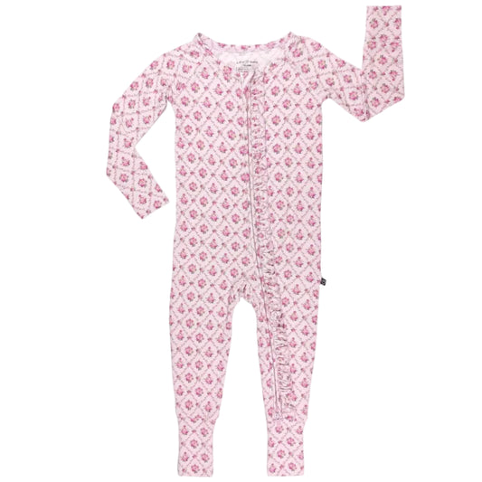 Pink floral patterned romper on a white background