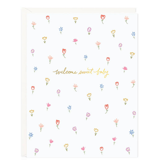 New baby card with delicate floral illustrations and gold foil hand-lettering