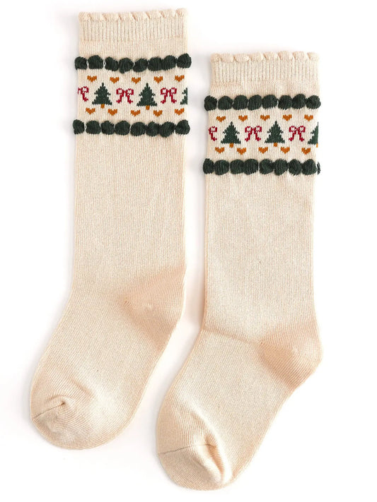Pair of cream socks with festive pattern on a white background