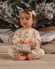 Kitties Henley Romper in an antique color with a two-button henley front