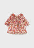 Floral dress with long sleeves on a light gray background