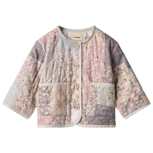 Patchwork floral quilted jacket for baby on a white background
