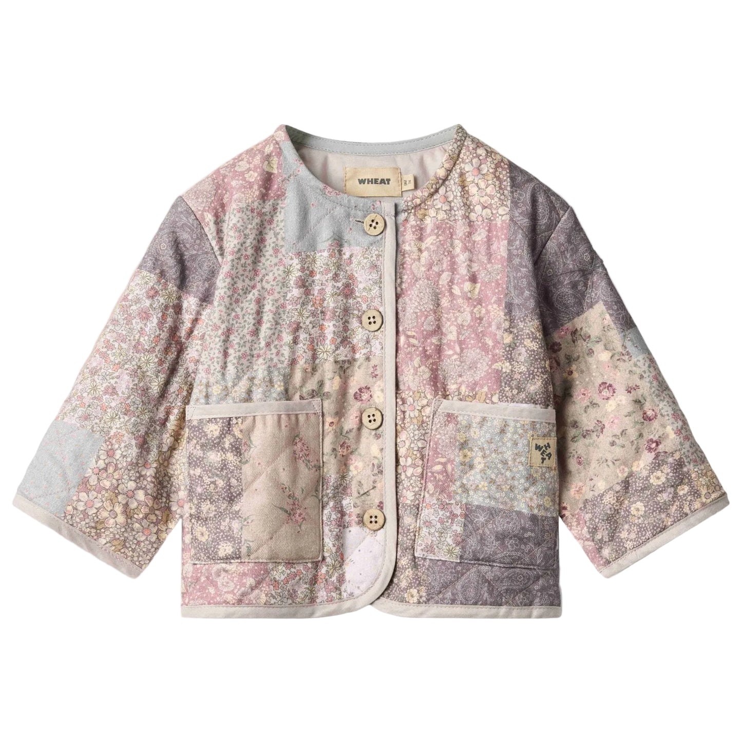 Patchwork floral quilted jacket for baby on a white background