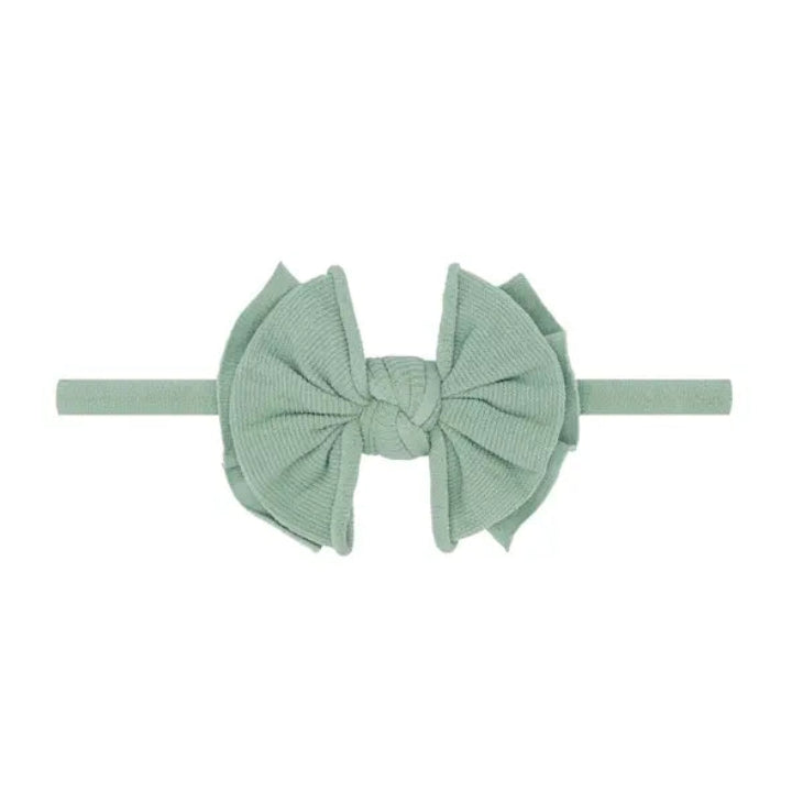 Green headband with a large bow