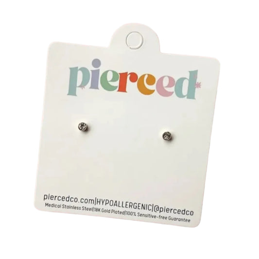 Pair of small round earrings on a 'pierced' branded card against a pink background