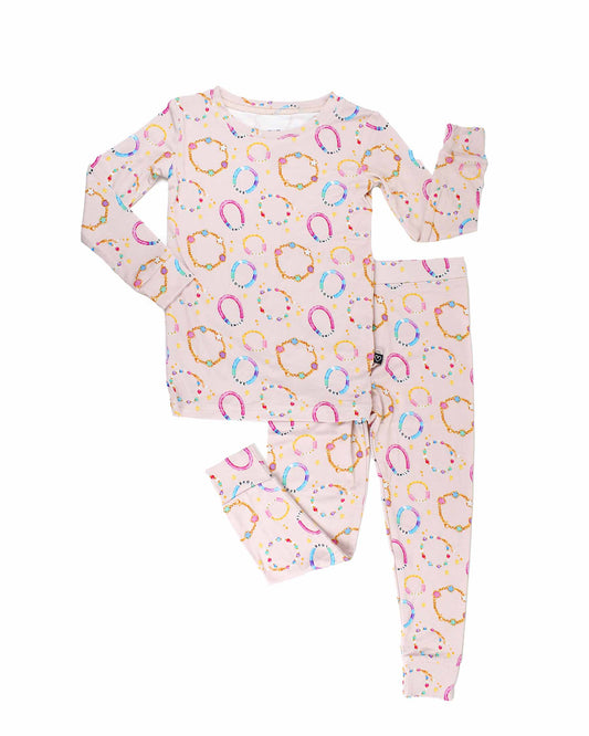 Children's pajama set with colorful pattern on a white background