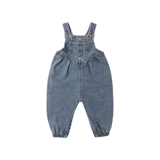 Blue denim overalls on a white background
