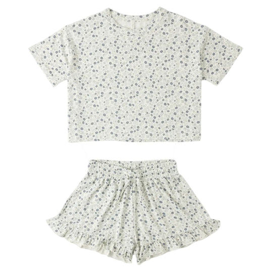 Floral-patterned shirt and shorts set on a white background