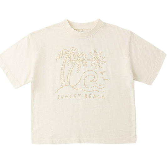 Beige t-shirt with palm tree and 'Sunset Beach' text design on a white background