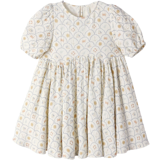 White dress with yellow floral pattern on a white background