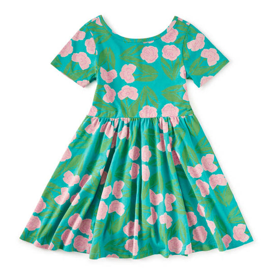 Floral dress with pink flowers on a teal background