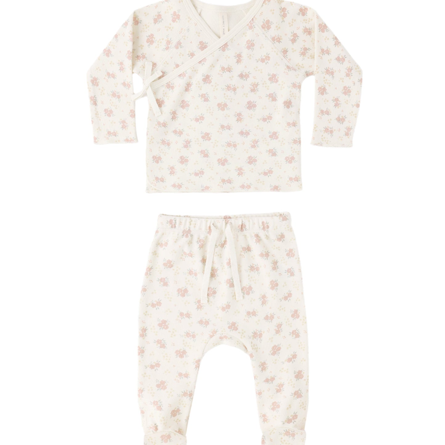 Baby outfit set with long-sleeve top and footed pants on a white background