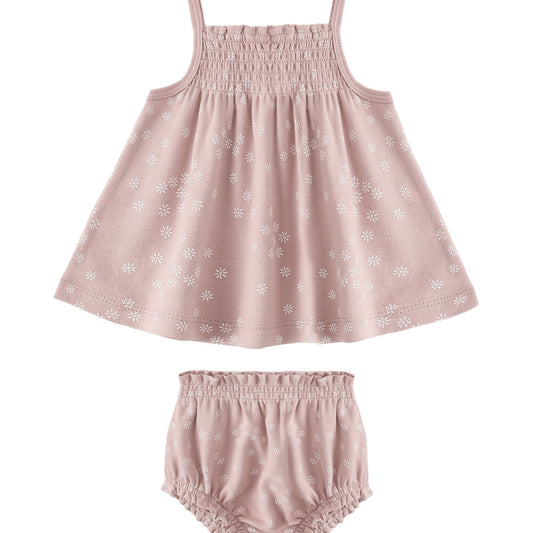 Pink baby dress with floral pattern and matching bloomers on a white background