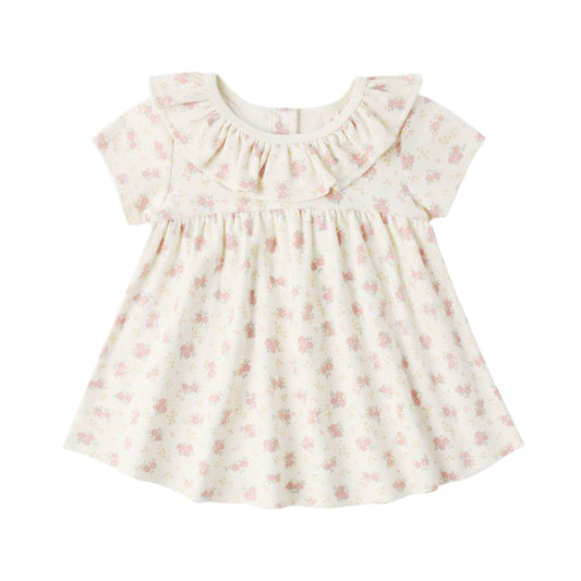 Baby dress with floral pattern on a white background
