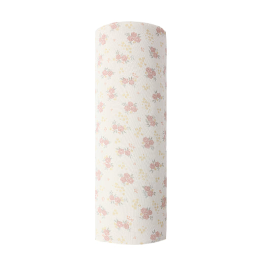 Floral-patterned cylindrical product on a white background