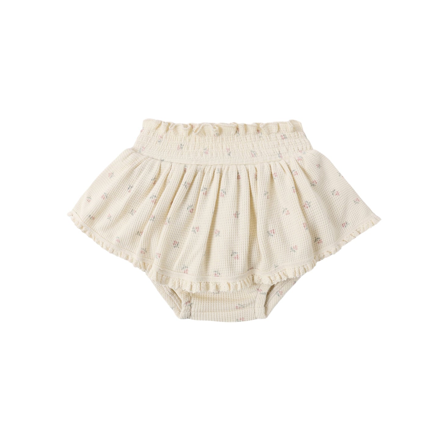Beige baby bloomers with ruffle details on a white background