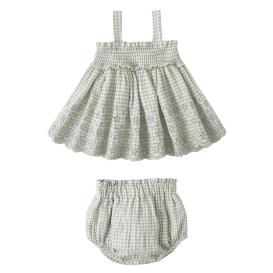Checkered baby dress with matching bloomers on a white background