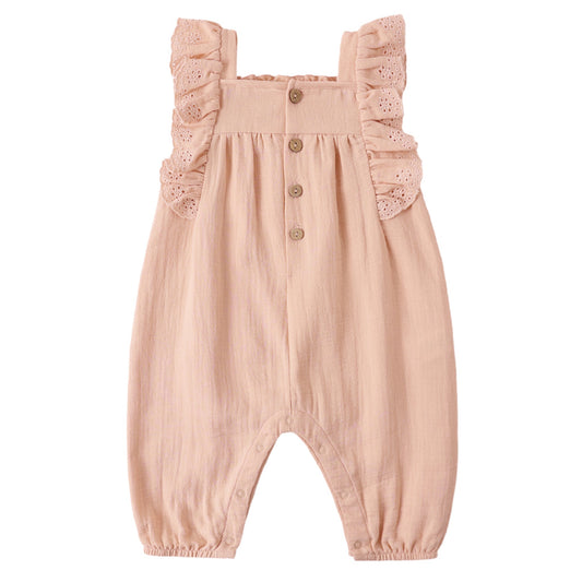Pink baby romper with ruffled straps on a white background