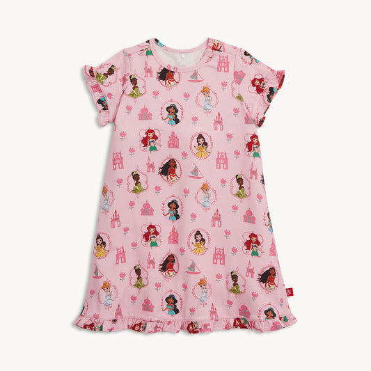Pink children's nightgown with princess and castle pattern on a white background
