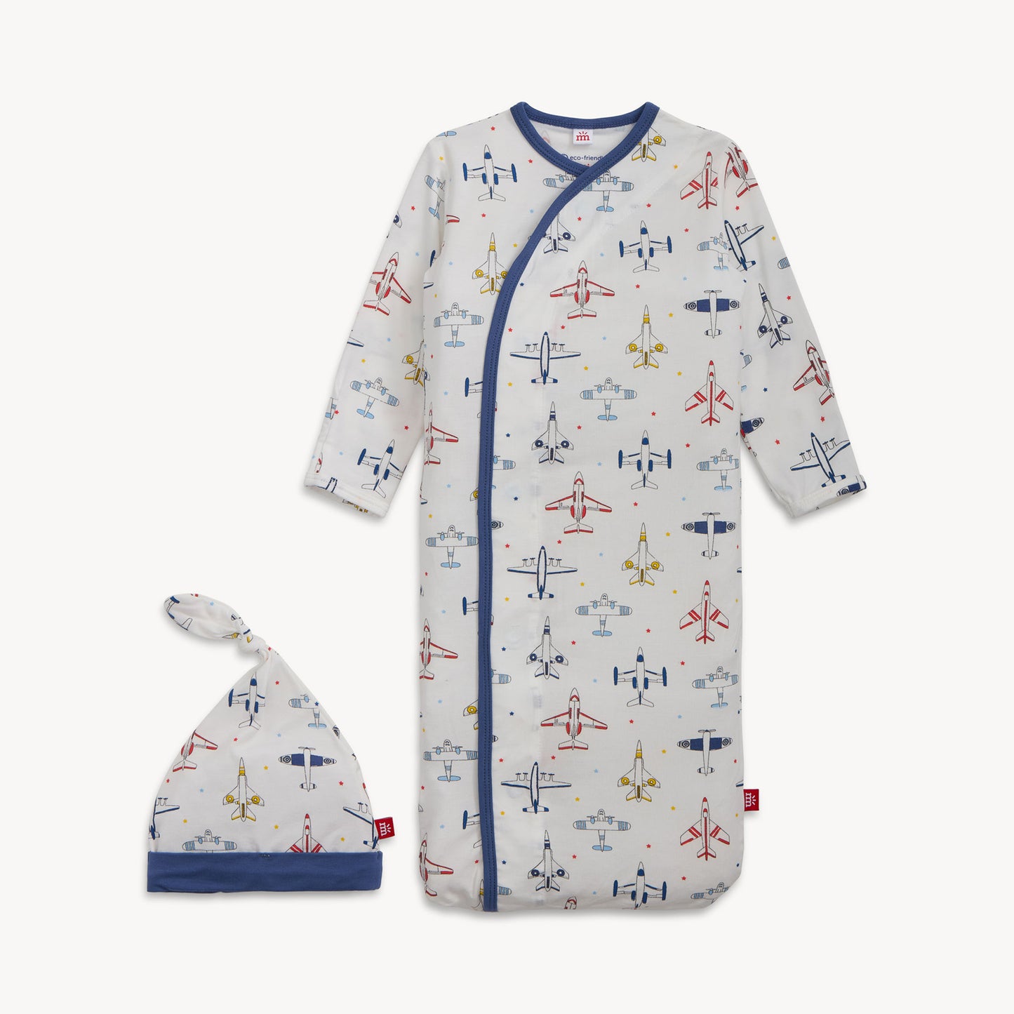 Baby onesie with airplane pattern and matching hat on a white background