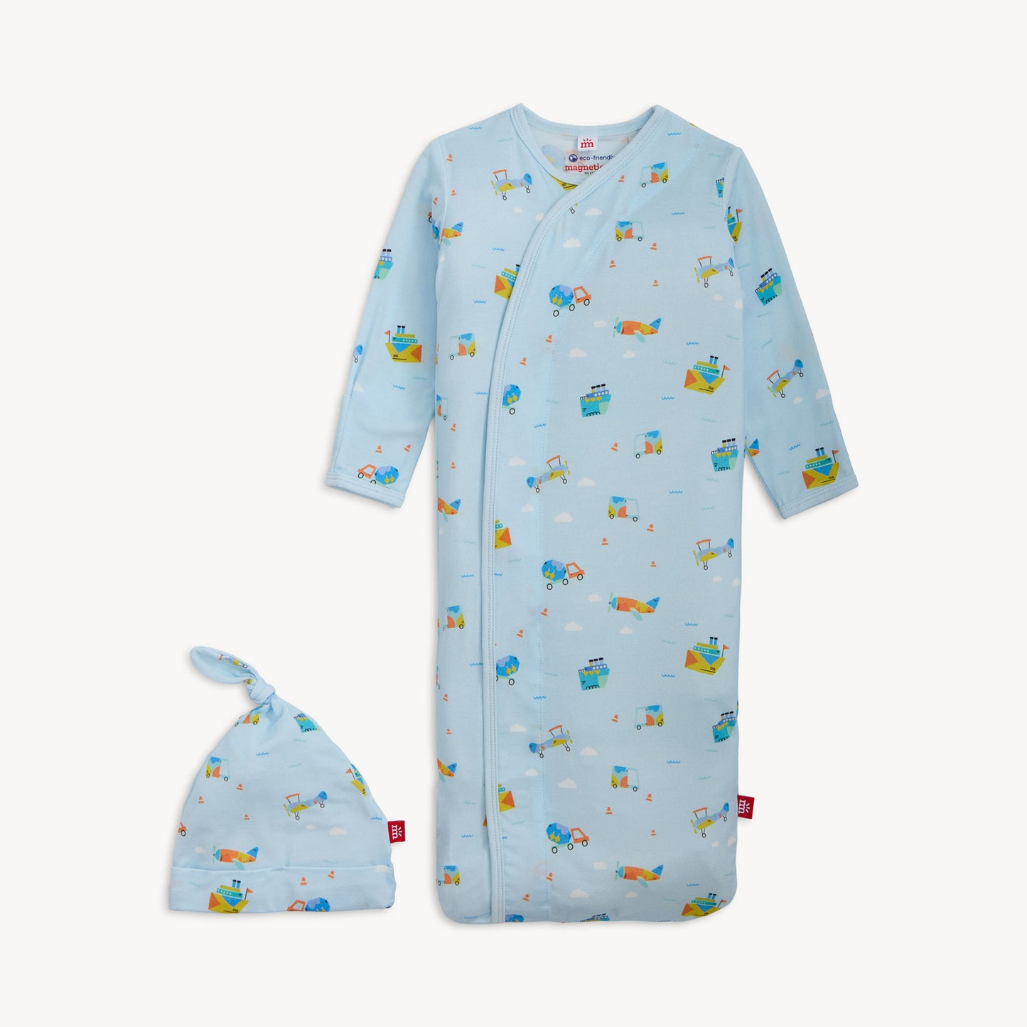 Baby gown with long sleeves and a matching hat on a white background