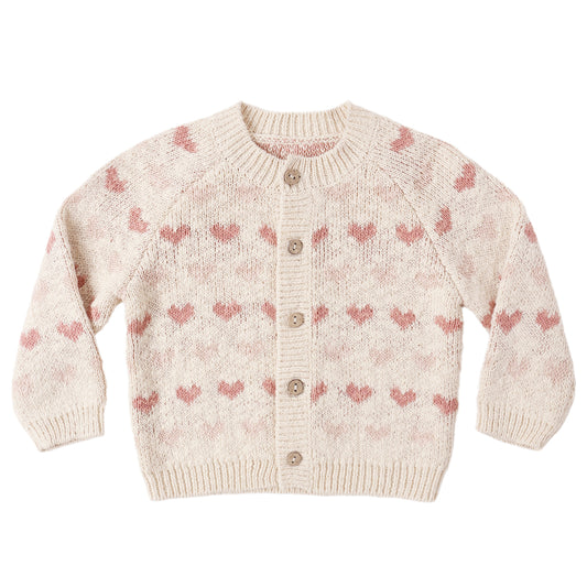 Knitted cardigan with pink heart pattern on a white background