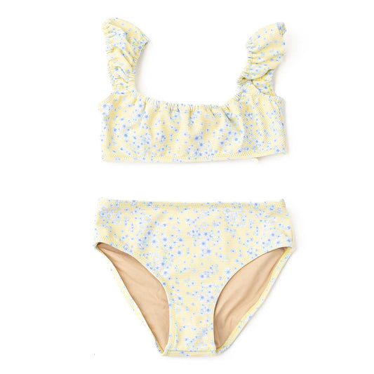 Yellow floral bikini set on a white background