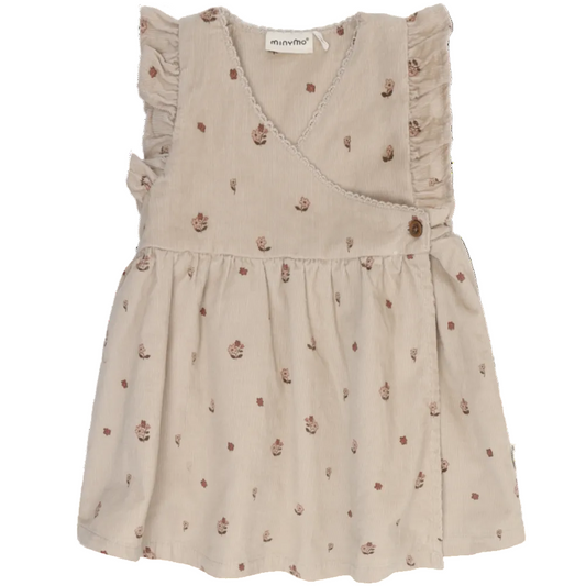 Beige dress with floral pattern on a white background