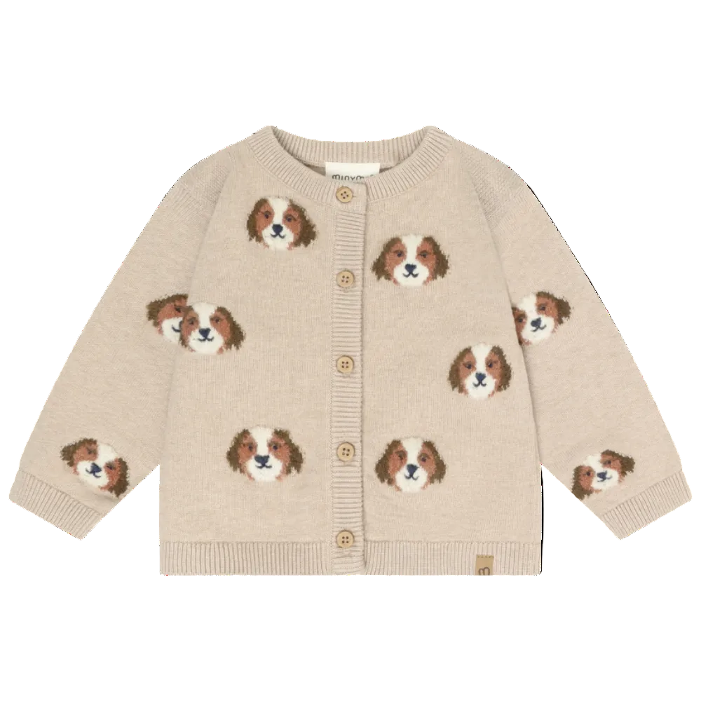 Beige cardigan with dog face patterns on a white background