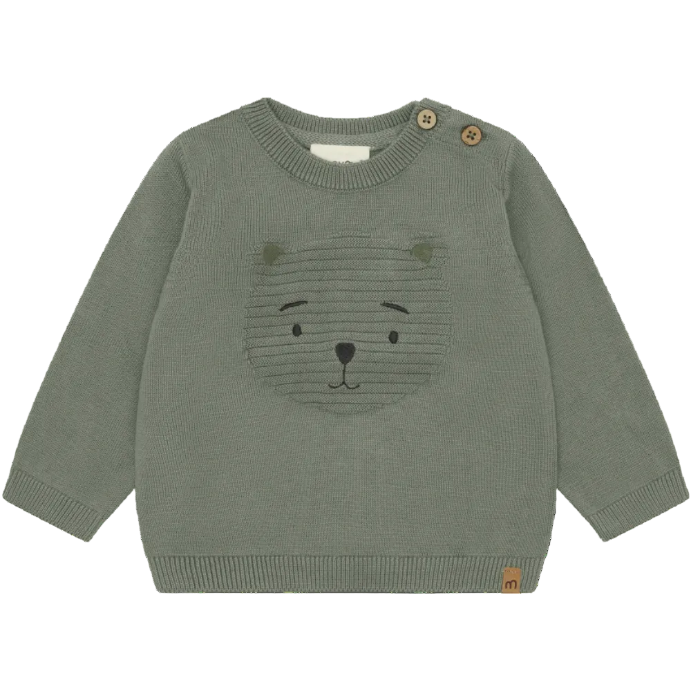 Green sweater with bear face design on a white background