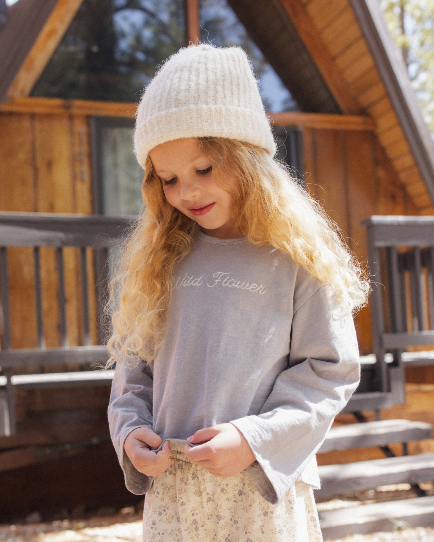 Girl wearing the Wildflower Luna Top standing outdoors
