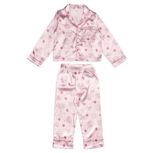 Pink children's pajama set with a pattern on a white background