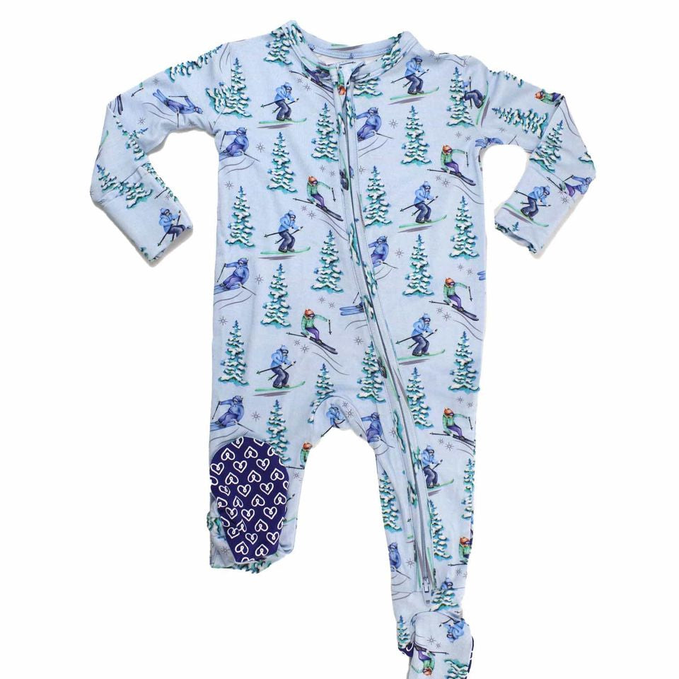 Baby onesie with skiing design on a white background