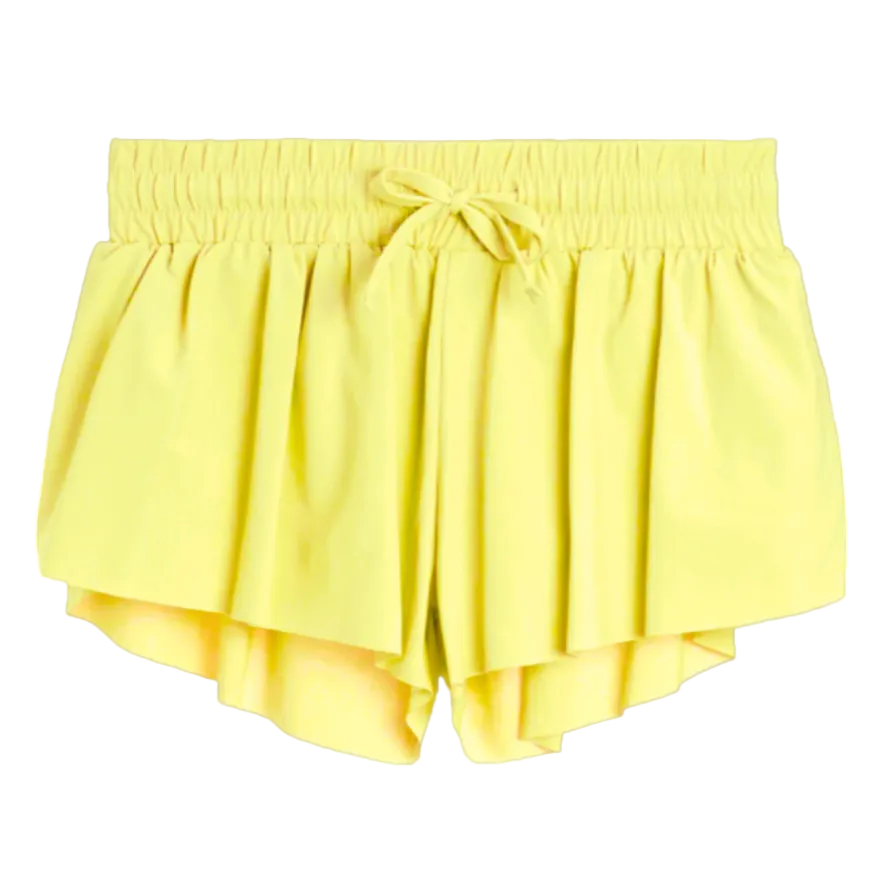 Yellow shorts with a tie waist on a white background
