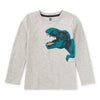 A light grey long-sleeve children's t-shirt with a dinosaur print positioned above the waist.