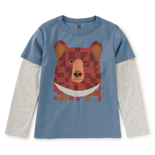 A long sleeve boy's shirt with a layered design featuring a bear's face on the front in a blue and gray color palette.