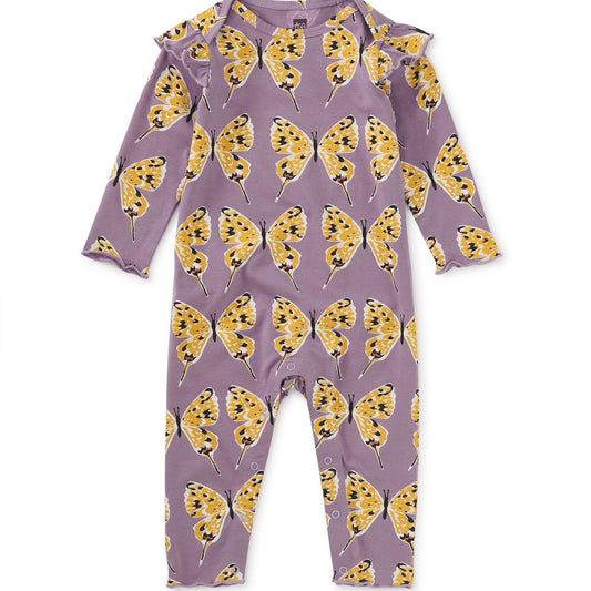 A long-sleeved purple romper with a pattern of yellow dragon butterflies, featuring an envelope neckline and snaps at the inseam.