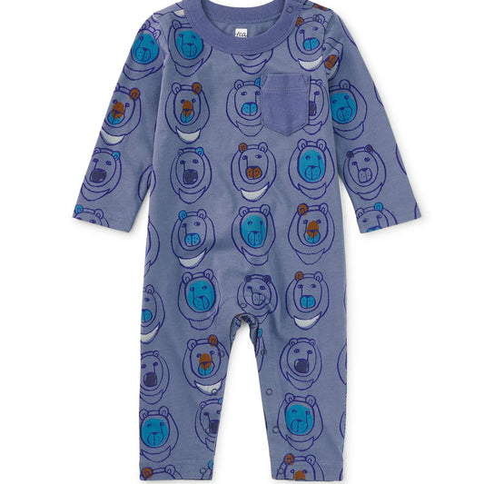 A blue long-sleeved baby romper with a pattern of bear faces, snaps at the neck and inseam, and a chest patch pocket.