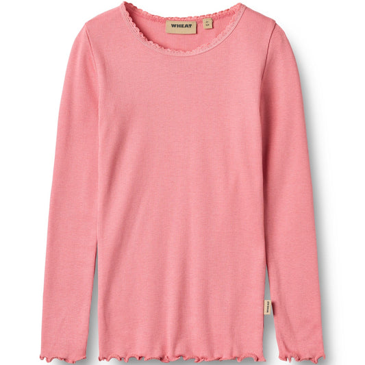 Pink long-sleeve top with frayed hem on a white background
