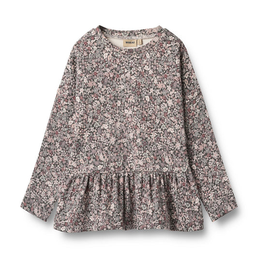 Floral patterned dress on a white background