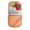 Toy set in a clear plastic container with 'Magnolia Dough Co.' label on a brown background