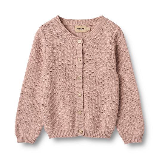 Pink knitted cardigan with button details on a light gray background